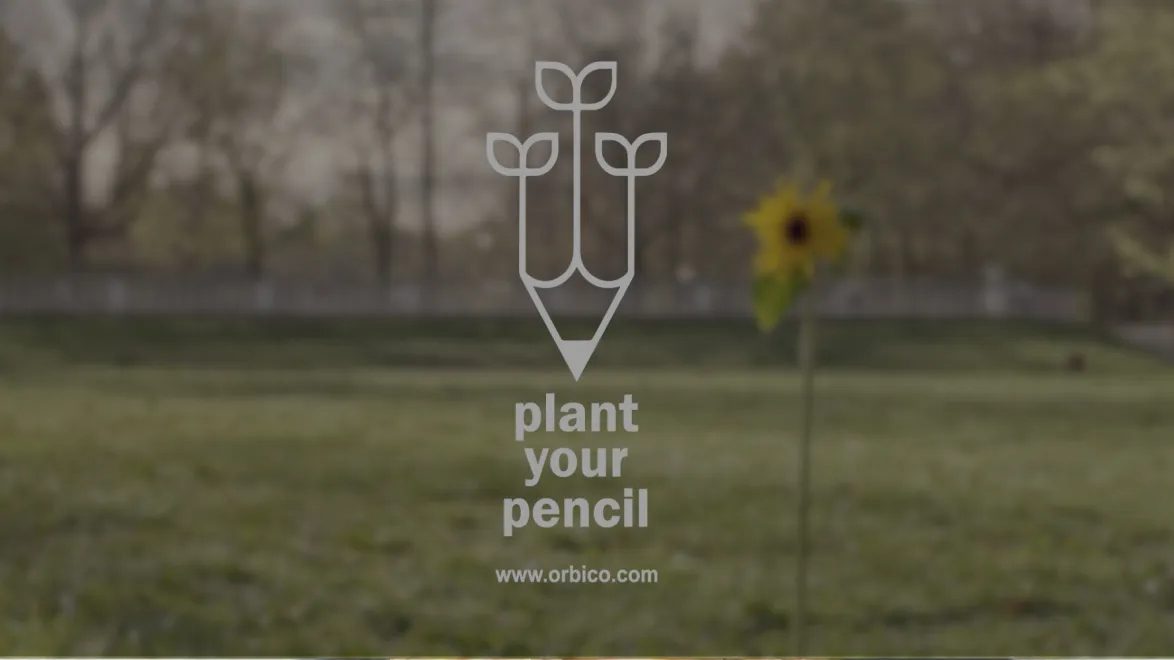 Graphic of a pencil with three sprouting leaves above the text 'plant your pencil' and 'www.orbico.com' over a blurred outdoor background with a sunflower.